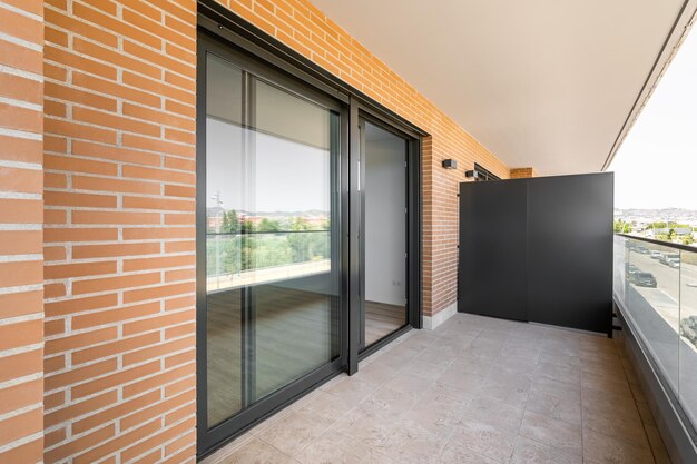 large entrance balcony door made black plastic with sliding system terrace with marble floor 157754 1153